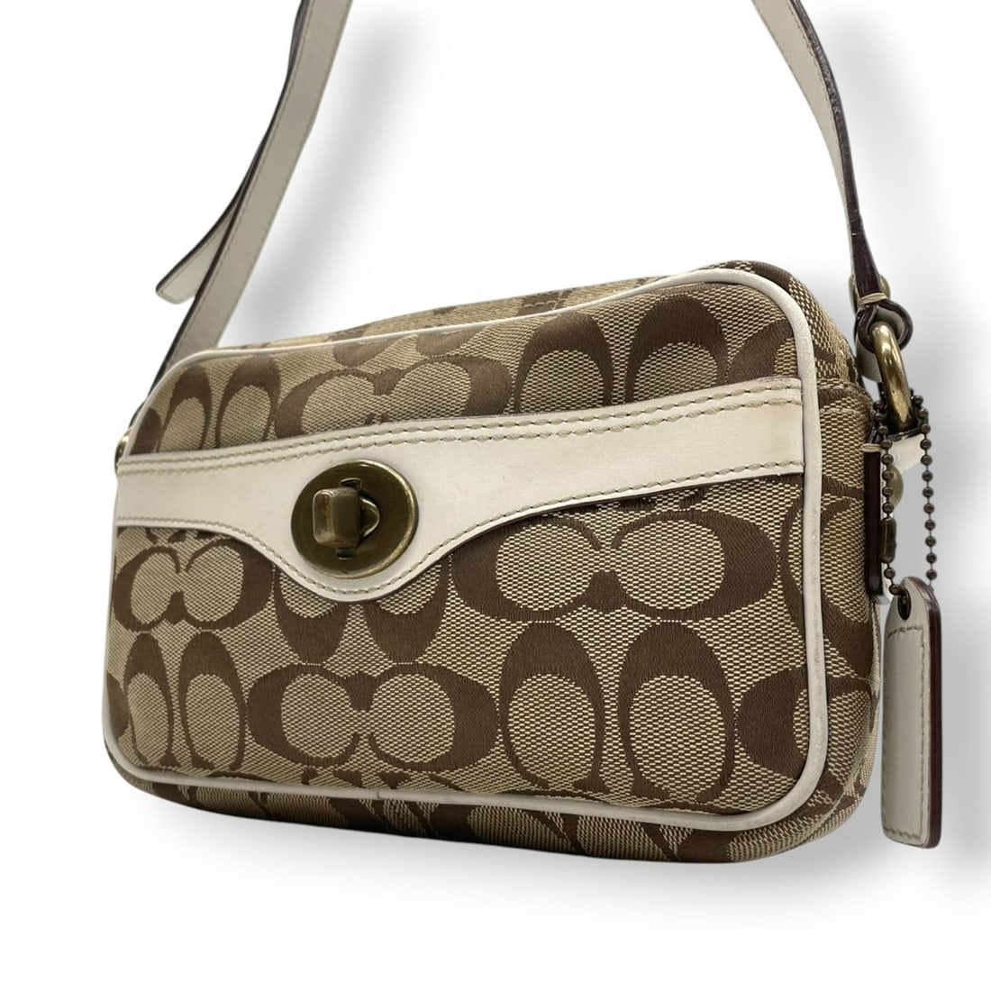 Coach Women's Signature Canvas and Leather Shoulder Bag with Turnlock Closure, Brown White, 10565: --- Catalog ---Category: SizeSize (HxWxD): 12cm x 20cm x 5cm / 4.72'' x 7.87'' x 1.96''Category: DesignType: Shoulder bagColor: Brown, WhiteGender: WomenMaterial: Canvas , Leather Category: