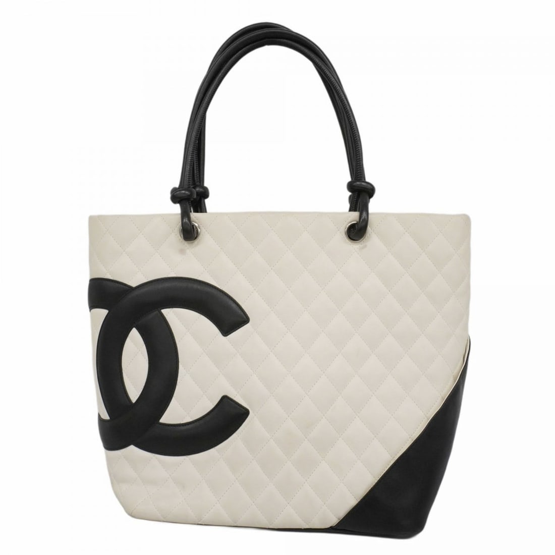 Chanel Cambon tote bag in lambskin, white and black, for women: --- Catalog ---Category: SizeSize (HxWxD): 28cm x 25cm x 15cm / 11.02'' x 9.84'' x 5.9''Category: DesignType: Tote bagColor: Black, WhiteGender: WomenMaterial: Leather Hardware Color: SilverLeather/Fu