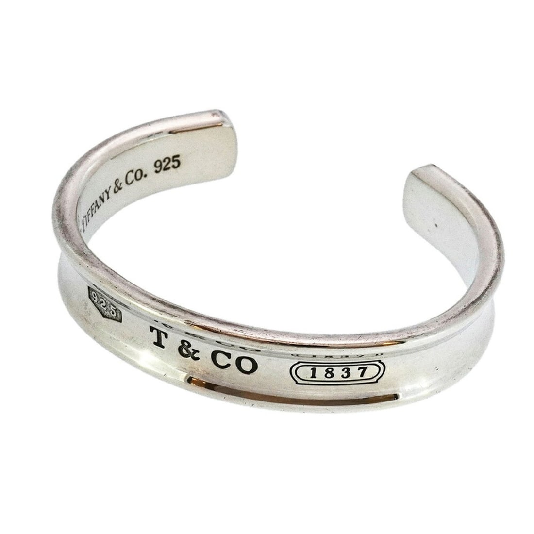 Tiffany Bangle 1837 Silver 925 Women's: --- Catalog ---Category: SizeLength: 14.5cm / 5.7''Category: DesignType: BangleGender: WomenMaterial: Silver 925Category: GeneralBrand: Tiffany--- Item List ---Section: ConditionRanking: Rank AB Used