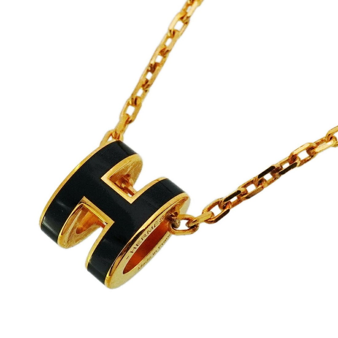 Hermes Hermès Mini Pop Ash Necklace in GP-Plated Gold and Black for Women: --- Catalog ---Category: SizePendant Size: 9mm x 7.3mm / 0.35'' x 0.28''Neck Circumference: 40.5 cm / 15.94''Category: DesignColor: Black, GoldGender: WomenMaterial: Gold platingNecklace Type: Necklac
