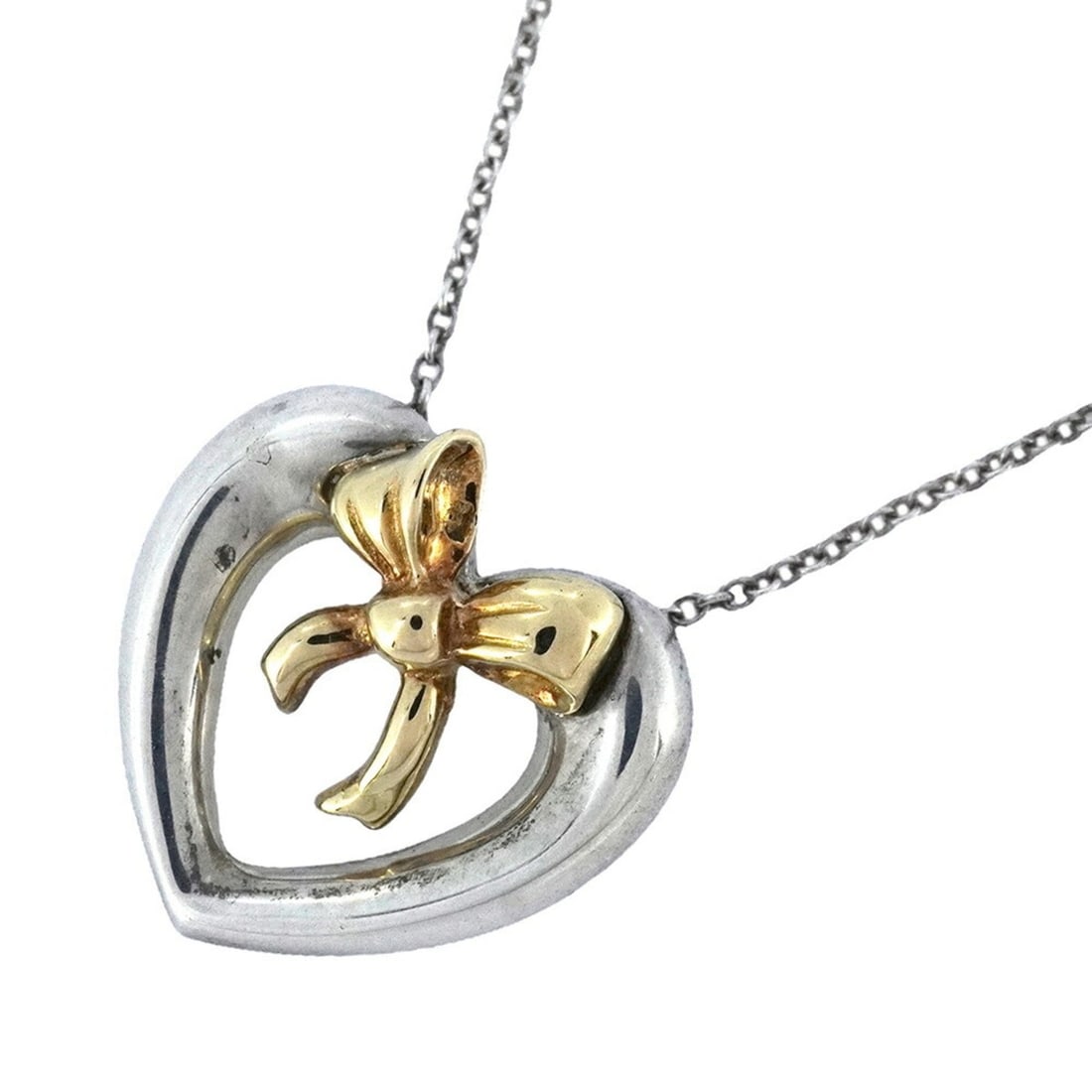 Tiffany Heart Ribbon Necklace in 18K Yellow Gold and 925 Silver for Women: --- Catalog ---Category: SizePendant Size: 17.8mm x 18mm / 0.7'' x 0.7''Neck Circumference: 41.5 cm / 16.33''Category: DesignGender: WomenMaterial: Silver 925, Yellow gold (18K)Necklace Type:
