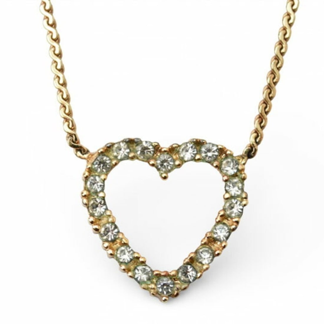 Christian Dior necklace pendant with heart motif and rhinestones in gold: --- Catalog ---Category: SizePendant Size: 16mm x 16mm / 0.62'' x 0.62''Neck Circumference: 38 cm - 42 cm / 14.96'' - 16.53''Category: DesignColor: GoldStone: RhinestoneGender: WomenPendant Type: Pend