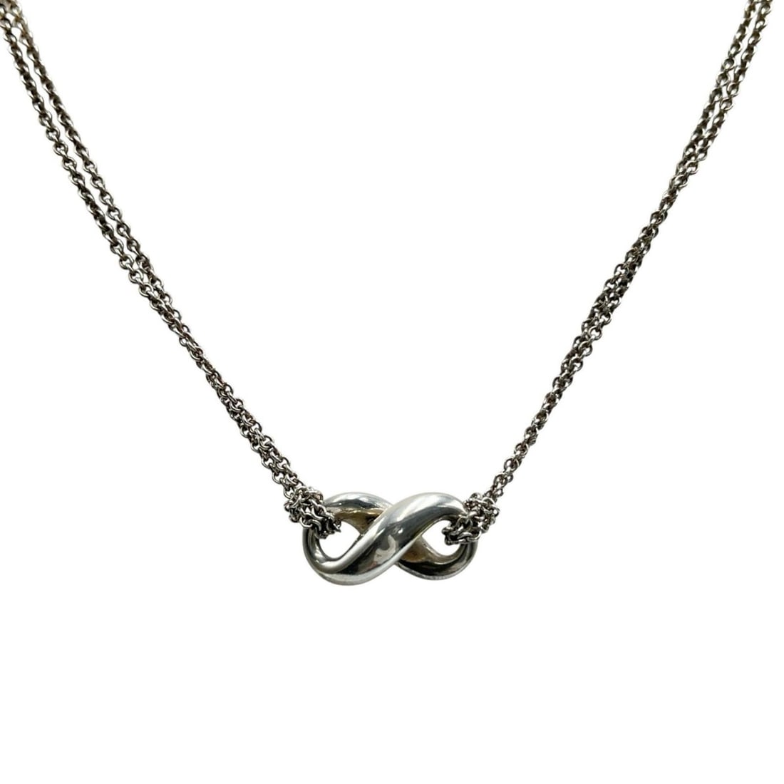 Tiffany & Co. Infinity Double Chain Necklace in Sterling Silver for Women: --- Catalog ---Category: SizePendant Size: 10mm x 18mm / 0.39'' x 0.7''Neck Circumference: 40.2 cm / 15.82''Category: DesignColor: SilverGender: WomenMaterial: Silver 925Necklace Type: