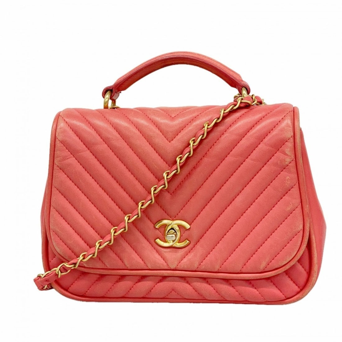 Chanel handbag with V-stitched chain shoulder strap in pink lambskin, 2-way bag for women: --- Catalog ---Category: SizeSize (HxWxD): 18cm x 25cm x 8.5cm / 7.08'' x 9.84'' x 3.34''Category: DesignType: HandbagColor: PinkGender: WomenMaterial: Leather Hardware Color: GoldLeather/Fur Type: La