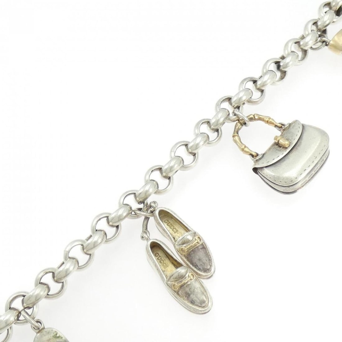 Gucci 925 750YG bracelet: --- Catalog ---Category: SizeWeight: 110.9g / 3.91oz.Total Length: 20.5cm / 8.07''Category: DesignType: Charm braceletGender: WomenMaterial: Silver 925, Yellow gold (18K)Category: GeneralBrand: