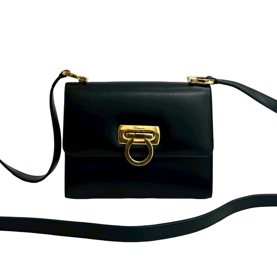 Salvatore Ferragamo Gancini Leather Mini Shoulder Bag/Pochette in Black 36914: --- Catalog ---Category: SizeSize (HxWxD): 12cm x 15.5cm x 6cm / 4.72'' x 6.1'' x 2.36''Category: DesignType: Pochette, Shoulder bagColor: BlackGender: WomenMaterial: Leather Category: GeneralBrand: S