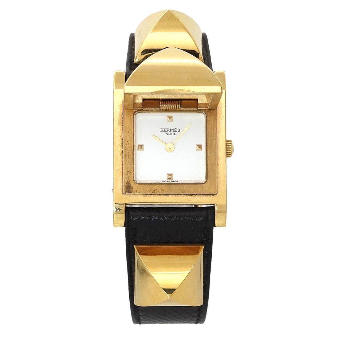 Hermès Medor Women's Pyramid Gold Stud Watch in White and Black Leather with Quartz Movement: --- Catalog ---Category: SizeWrist Size: 14cm - 16.5cm / 5.51'' - 6.49''Case Diameter: 23mm / 0.91''Category: DesignType: WristwatchGender: WomenColor (Dial): WhiteMaterial (Band): Gold plated, Leathe