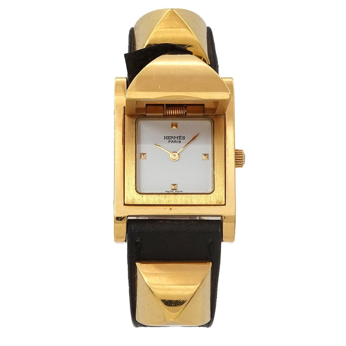 Hermès Medor Women's Pyramid Gold Stud Watch in White and Black Leather with Quartz Movement: --- Catalog ---Category: SizeWrist Size: 14cm - 16.5cm / 5.51'' - 6.49''Case Diameter: 23mm / 0.91''Category: DesignType: WristwatchGender: WomenColor (Dial): WhiteMaterial (Band): Gold plated, Leathe