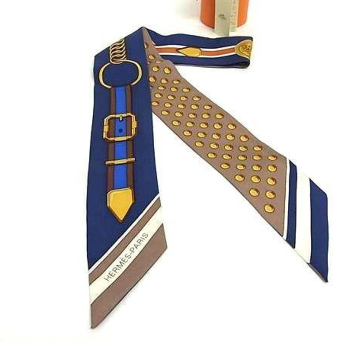 HERMES Ribbon Twilly Scarf/Muffler, Multicolored Silk, Women's, GRAND TRALALA: --- Catalog ---Category: SizeSize (LxW): 88cm x 5cm / 34.64'' x 1.96''Category: DesignType: ScarfColor: Multi-colorGender: WomenMaterial: Silk 100%Category: GeneralLine: TwillyBrand: HermesCountry of