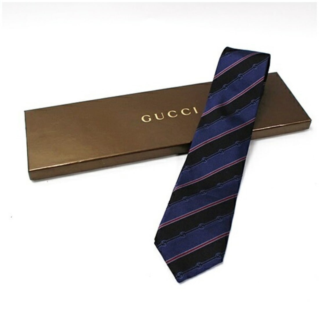 Gucci Silk Tie Stripe Current Model GUCCI Men's: --- Catalog ---Category: SizeWidth: 8cm / 3.14''Category: DesignType: CravatColor: Black, Navy, Red colorGender: MenMaterial: Silk Category: GeneralBrand: Gucci--- Item List ---Section: ConditionRanki