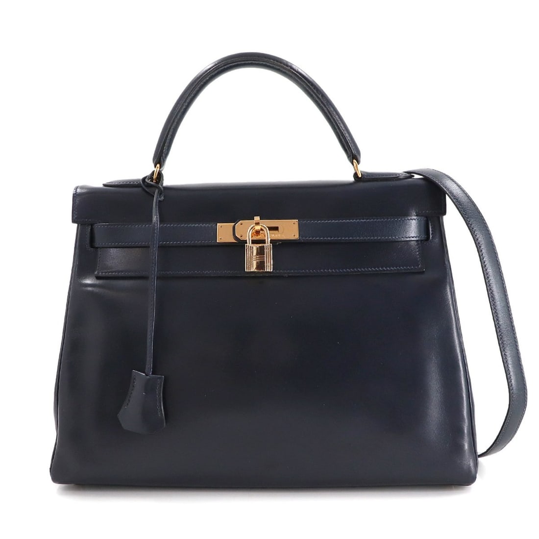 Hermes Hermès Kelly 32, navy box calf leather, 2-way handbag, inner stitching, ?U stamp, gold: --- Catalog ---Category: SizeSize (HxWxD): 22.5cm x 31.5cm x 11.5cm / 8.85'' x 12.4'' x 4.52''Category: DesignType: HandbagColor: NavyGender: WomenMaterial: Box calf leather Category: GeneralBrand: He