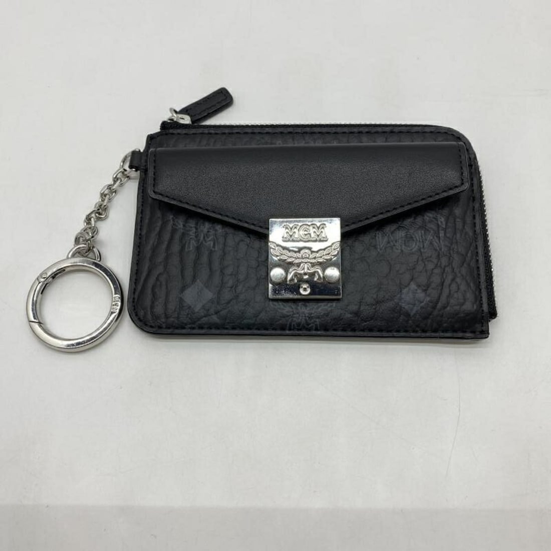 MCM Mini Tracy Wallet/Coin Case, Black: --- Catalog ---Category: SizeSize (HxWxD): 8.5cm x 12.5cm x 8.00mm / 3.34'' x 4.92'' x 0.31''Category: DesignType: Coin purse/coin caseColor: BlackGender: WomenCategory: GeneralBrand: MCM--- Item