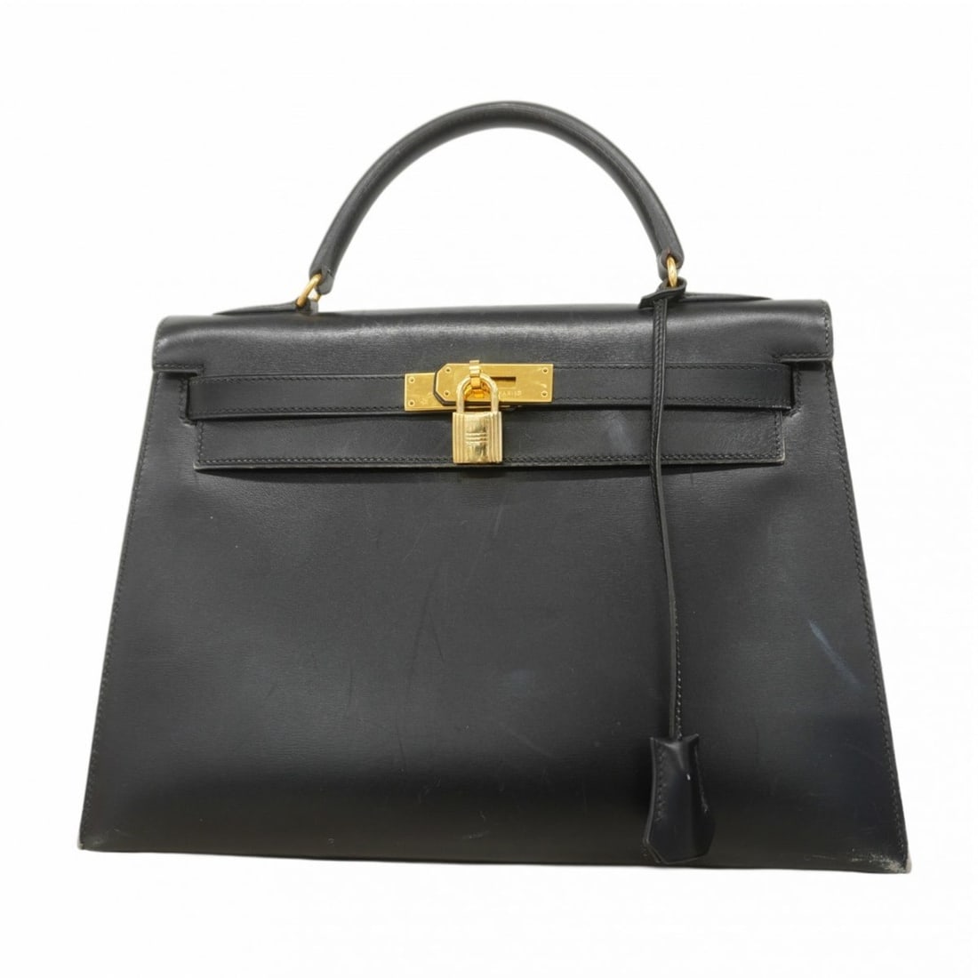 Hermes Hermès Kelly 32 Handbag in Black Box Calf Leather with ?Y Stamp for Women: --- Catalog ---Category: SizeSize (HxWxD): 24cm x 33cm x 12cm / 9.44'' x 12.99'' x 4.72''Category: DesignType: HandbagColor: BlackGender: WomenMaterial: Box calf leather Hardware Color: GoldCategory: