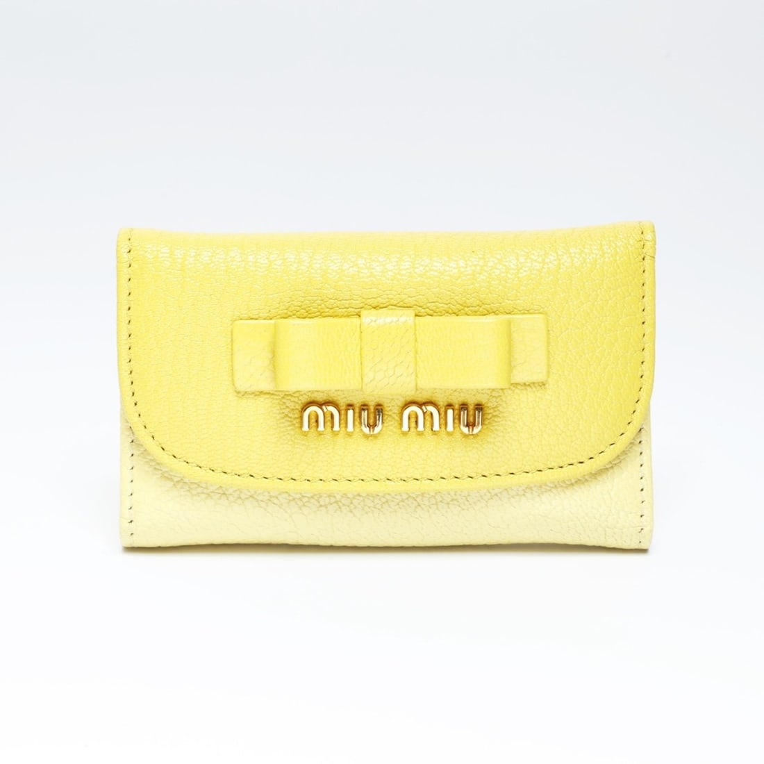 Miu Miu Miu Leather Ribbon Key Case in Yellow: --- Catalog ---Category: DesignType: KeycaseColor: YellowGender: WomenCategory: GeneralBrand: Miu MiuCategory: Physical PropertiesSize (HxWxD): 6cm x 10.5cm x 1.8cm / 2.36'' x 4.13'' x 0.7''--- Item L