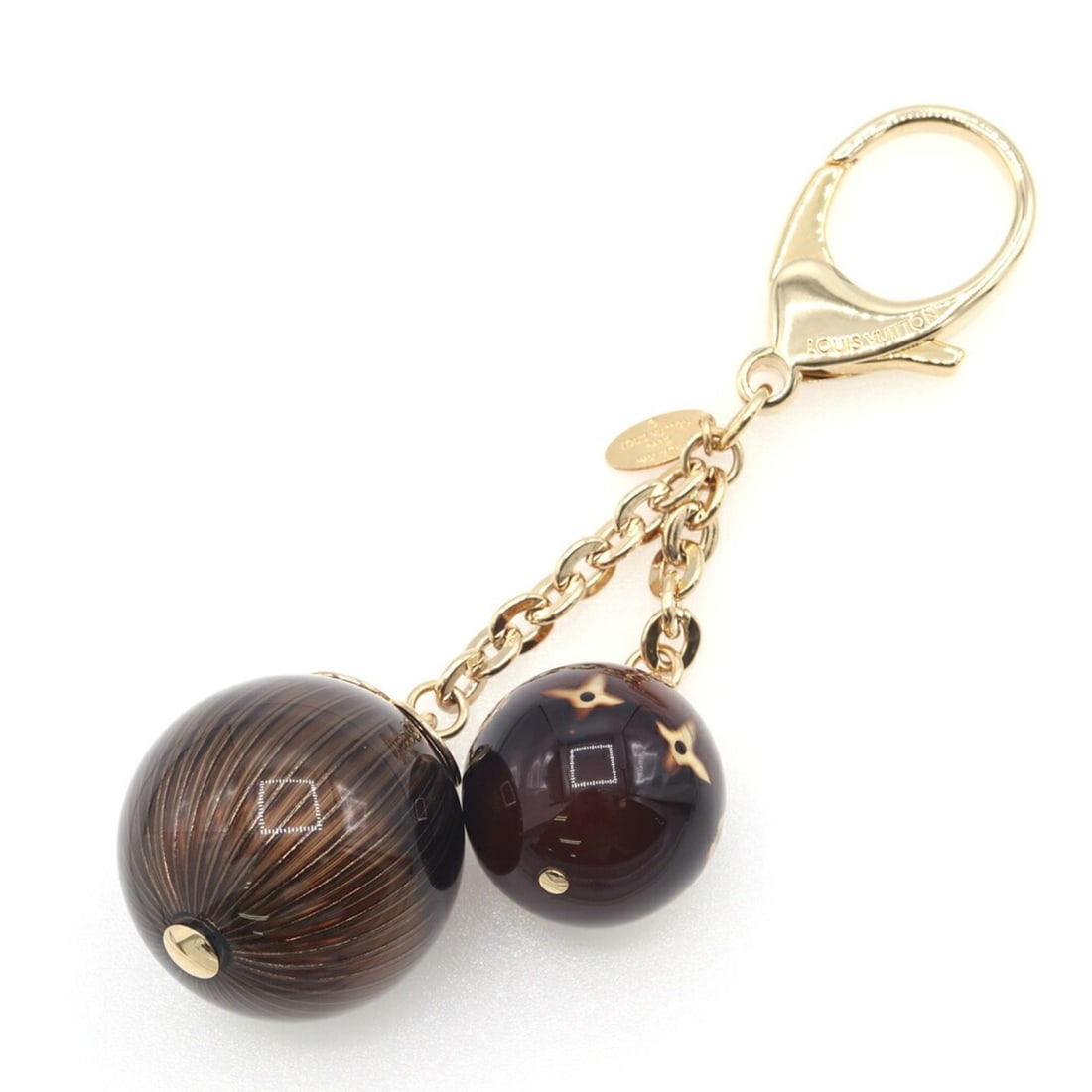 Louis Vuitton Accessories Bag Charm M66980 Dark Brown Metal Keychain Key Ring Ball for Women: --- Catalog ---Category: DesignType: KeyringColor: Dark brownGender: WomenMaterial: MetalCategory: GeneralBrand: Louis Vuitton--- Item List ---Section: ConditionRanking: Rank SA Used - Hardly any trac