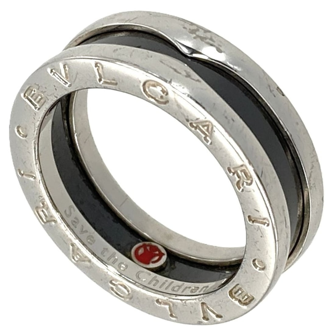 BVLGARI B-zero1 Save the Children 1-Band Ring, #55, SV925, 6.9g, Ceramic, Black, Silver: --- Catalog ---Category: SizeWidth: 6.8mm / 0.27''Weight: 6.9g / 0.24oz.US Size: 7.5Brand Size: 55Category: DesignType: Band ringColor: Black, SilverGender: WomenMaterial: Ceramic, Silver 925Category: