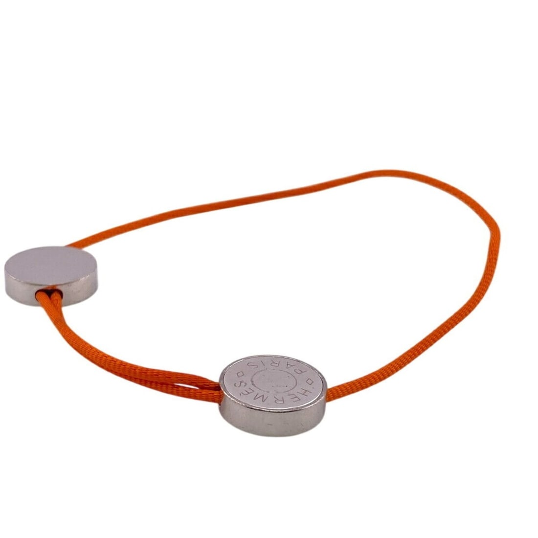 HERMES Serie Cord Button Bracelet in Orange: --- Catalog ---Category: SizeTotal Length: 20cm / 7.87''Category: DesignType: Charm braceletColor: OrangeGender: WomenMaterial: MetalCategory: GeneralBrand: Hermes--- Item List ---Section: ConditionRa