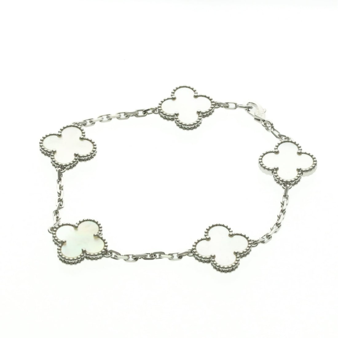 Van Cleef & Arpels Vintage Alhambra White Gold (18K) Mother Of Pearl Charm Bracelet Silver: --- Catalog ---Category: SizeLength: 17.5cm / 6.88''Weight: 12g / 0.42oz.Stone Size (HxW): 15cm x 15cm / 5.9'' x 5.9''Category: DesignType: Charm braceletColor: SilverMetal: White GoldStone: Mother of