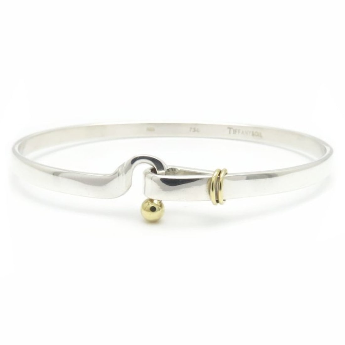 TIFFANY & Co. Tiffany Hook Eye Bangle, SV925x18KYG, Women's, 295059: --- Catalog ---Category: SizeLength: 18cm / 7.08''Category: DesignType: BangleColor: Silver, Yellow goldGender: WomenMaterial: Silver 925, Yellow gold (18K)Category: GeneralBrand: Tiffany--- Item List