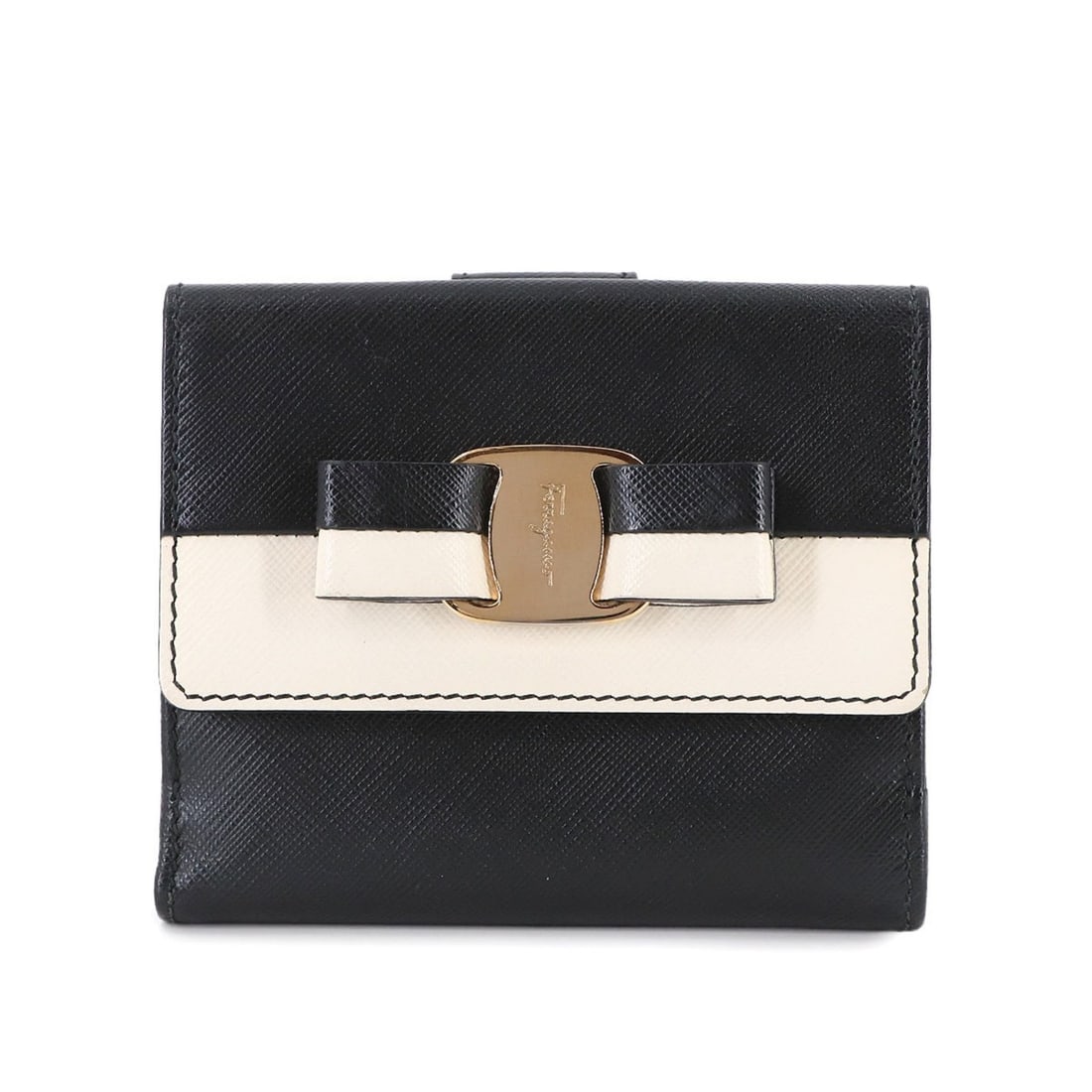 Salvatore Ferragamo Vara Ribbon Bifold Wallet in Black and White Leather: --- Catalog ---Category: SizeSize (HxWxD): 9cm x 12cm x 1.5cm / 3.54'' x 4.72'' x 0.59''Category: DesignType: Wallet (bi-fold)Color: Black, WhiteGender: WomenMaterial: Leather Category: GeneralBrand: