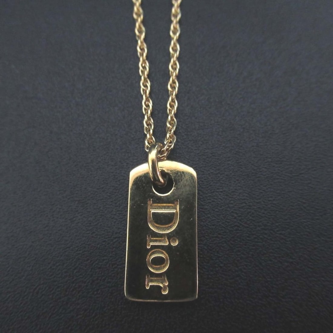 Vintage Christian Dior Dog Tag Logo Necklace Pendant in Gold, GP, for Women: --- Catalog ---Category: SizePendant Size: 23mm x 10mm / 0.9'' x 0.39''Neck Circumference: 37 cm - 42 cm / 14.56'' - 16.53''Category: DesignColor: GoldGender: WomenMaterial: Gold platingNecklace Type: