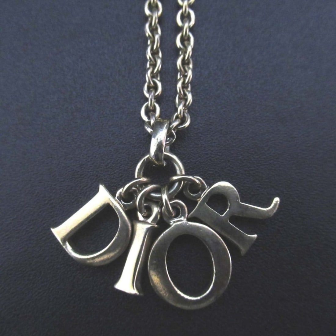 Vintage Christian Dior logo charm necklace pendant in GP gold for women.: --- Catalog ---Category: SizePendant Size: 30mm x 20mm / 1.18'' x 0.78''Neck Circumference: 41 cm - 45.5 cm / 16.14'' - 17.91''Category: DesignColor: GoldGender: WomenMaterial: Gold platingPendant Typ