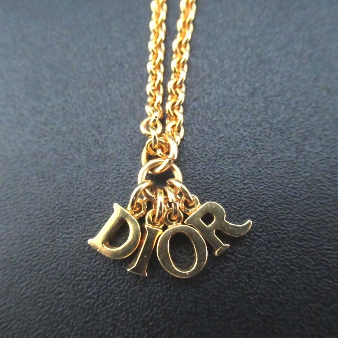 Vintage Christian Dior logo charm necklace pendant in GP gold for women.: --- Catalog ---Category: SizePendant Size: 15mm x 10mm / 0.59'' x 0.39''Neck Circumference: 38 cm - 43 cm / 14.96'' - 16.92''Category: DesignColor: GoldGender: WomenMaterial: Gold platingPendant Type: