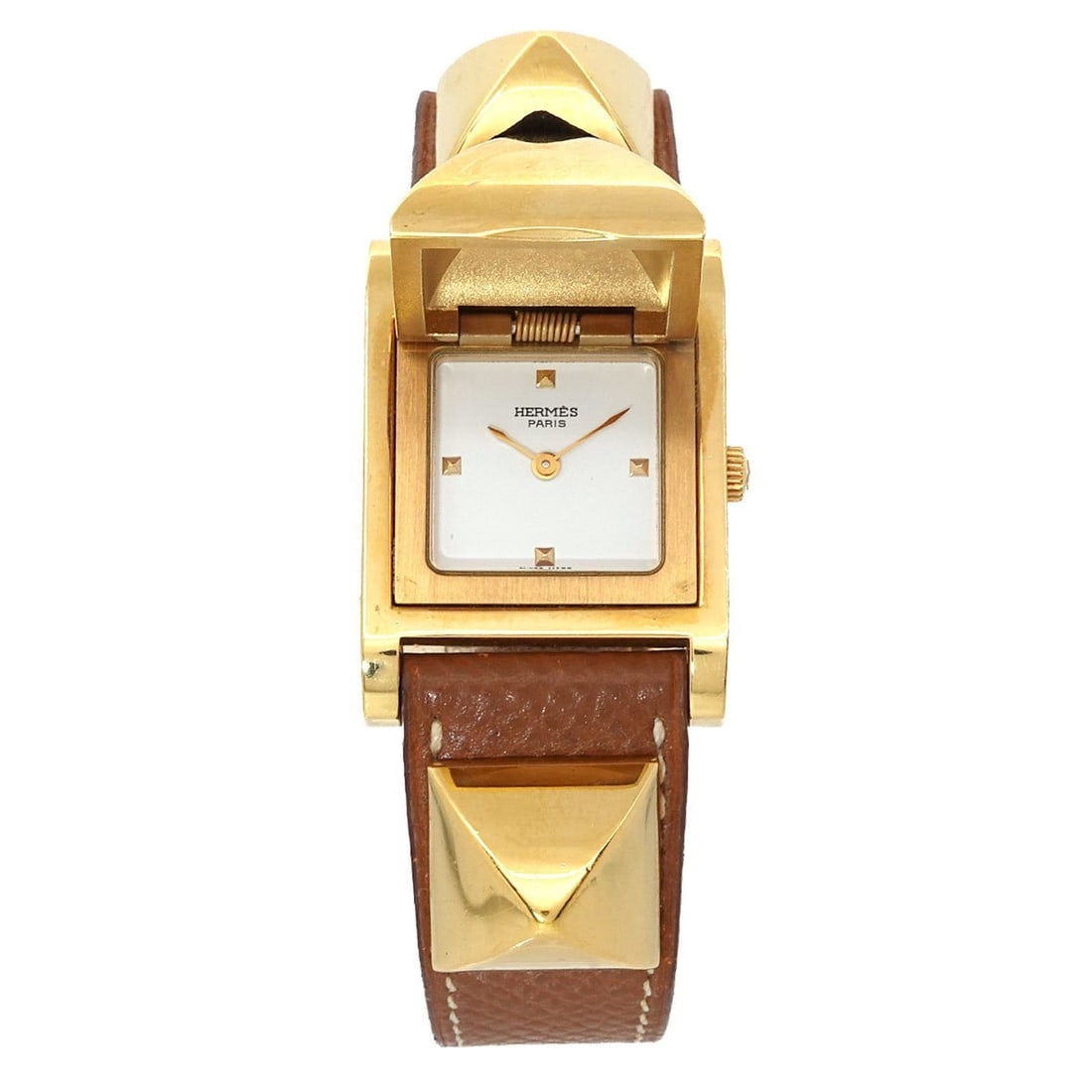 Hermès Medor Women's Pyramid Gold Stud Watch in White and Brown Leather with Quartz Movement: --- Catalog ---Category: SizeWrist Size: 14.5cm - 17cm / 5.7'' - 6.69''Case Diameter: 23mm / 0.91''Case Thickness: 16mm / 0.63''Category: DesignType: WristwatchColor: BrownGender: WomenDisplay: Analog