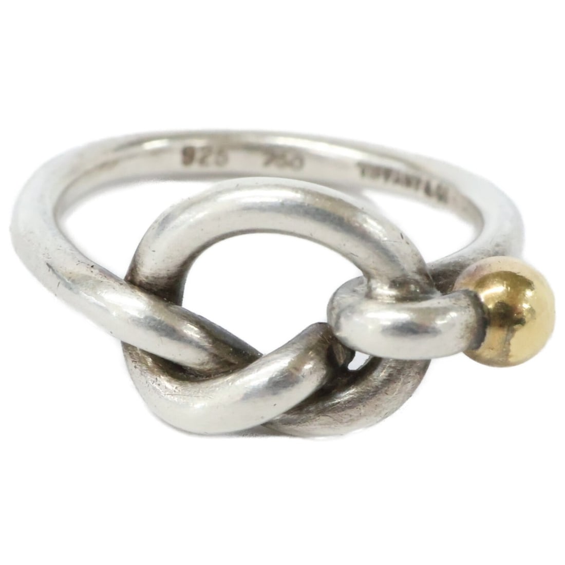 TIFFANY & Co. Tiffany 925 750 Love Knot Ring in Silver and Yellow Gold for Women: --- Catalog ---Category: SizeJP Size: 10US Size: 5.5Category: DesignType: Band ringColor: Silver, Yellow goldGender: WomenMaterial: Silver 925Category: GeneralBrand: Tiffany--- Item List ---Section: C
