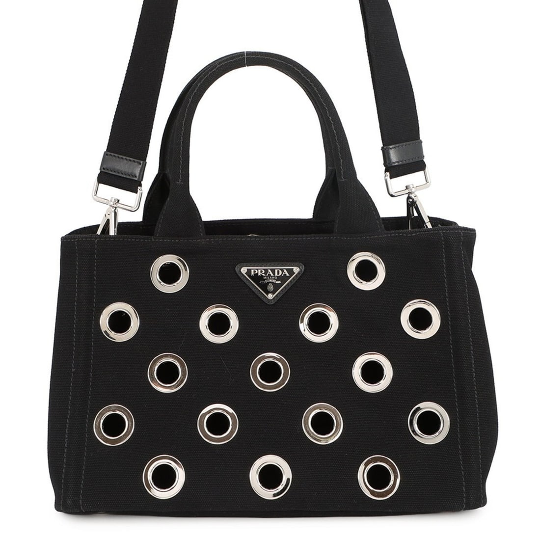 Prada Canapa tote bag in punched canvas (1BG439), black. Also available: 2-way handbags.: --- Catalog ---Category: SizeSize (HxWxD): 19cm x 28cm x 15cm / 7.48'' x 11.02'' x 5.9''Category: DesignType: Handbag, Tote bagColor: BlackGender: WomenMaterial: Canvas , Leather Category: GeneralMPN: