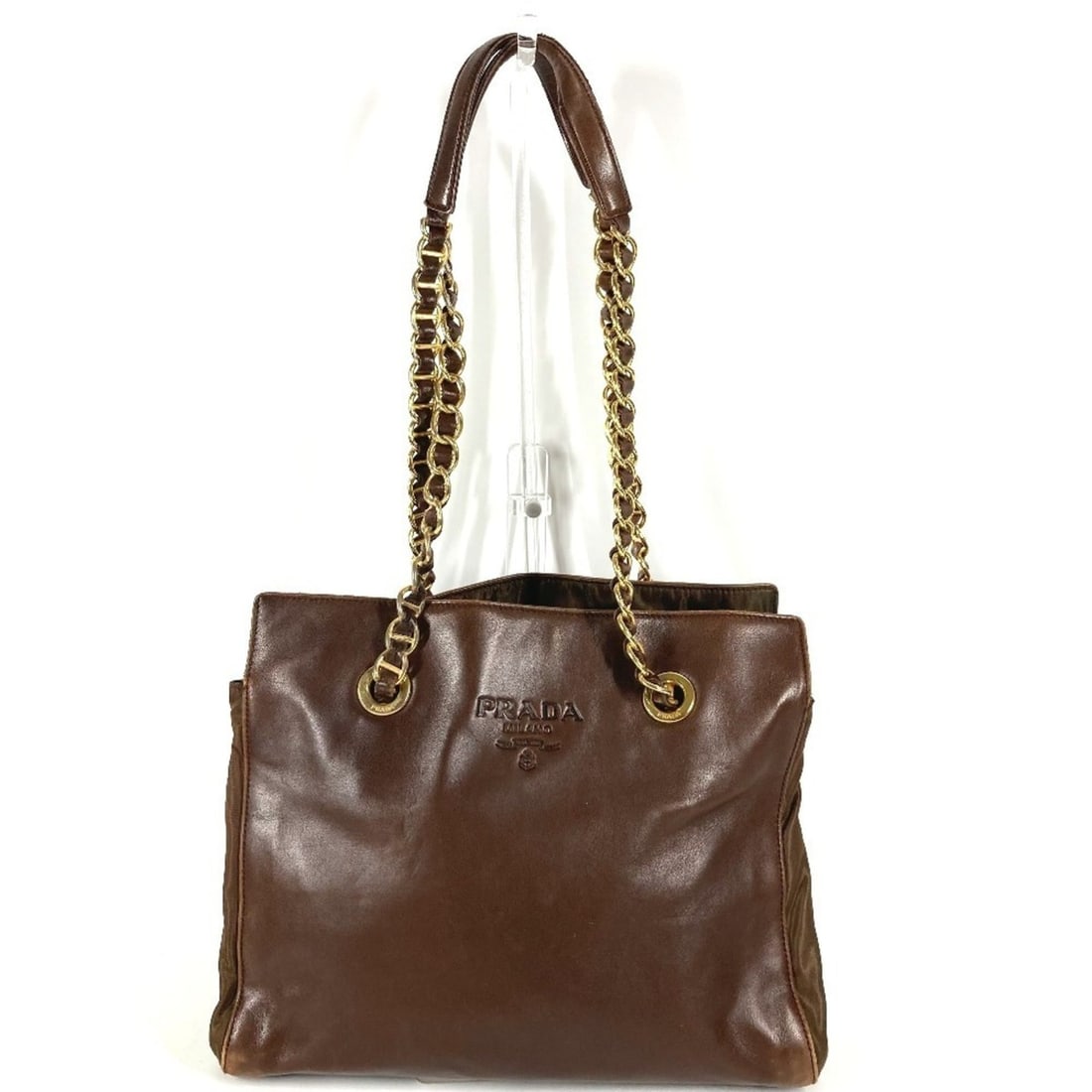 PRADA Triangle Logo Plaque Tote Bag with Double Chain Shoulder in Leather and Nylon for Men Women,: --- Catalog ---Category: SizeSize (HxWxD): 25.5cm x 30cm x 11.5cm / 10.03'' x 11.81'' x 4.52''Category: DesignType: Shoulder bag, Tote bagColor: BrownGender: Men,WomenMaterial: Leather , Nylon Categor