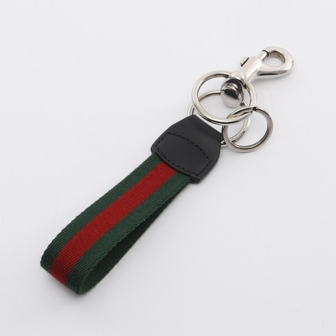 Gucci Web Stripe Keychain, Canvas, Leather, and Metal, Men's, Black, Red, Green, 804040JAAG1 8942: --- Catalog ---Category: SizeSize (HxWxD): 19cm x 2.5cm / 7.48'' x 0.98''Category: DesignType: Key ChainColor: Black, Green, Red colorGender: MenMaterial: Canvas, Leather, MetalCategory: GeneralMPN: 8