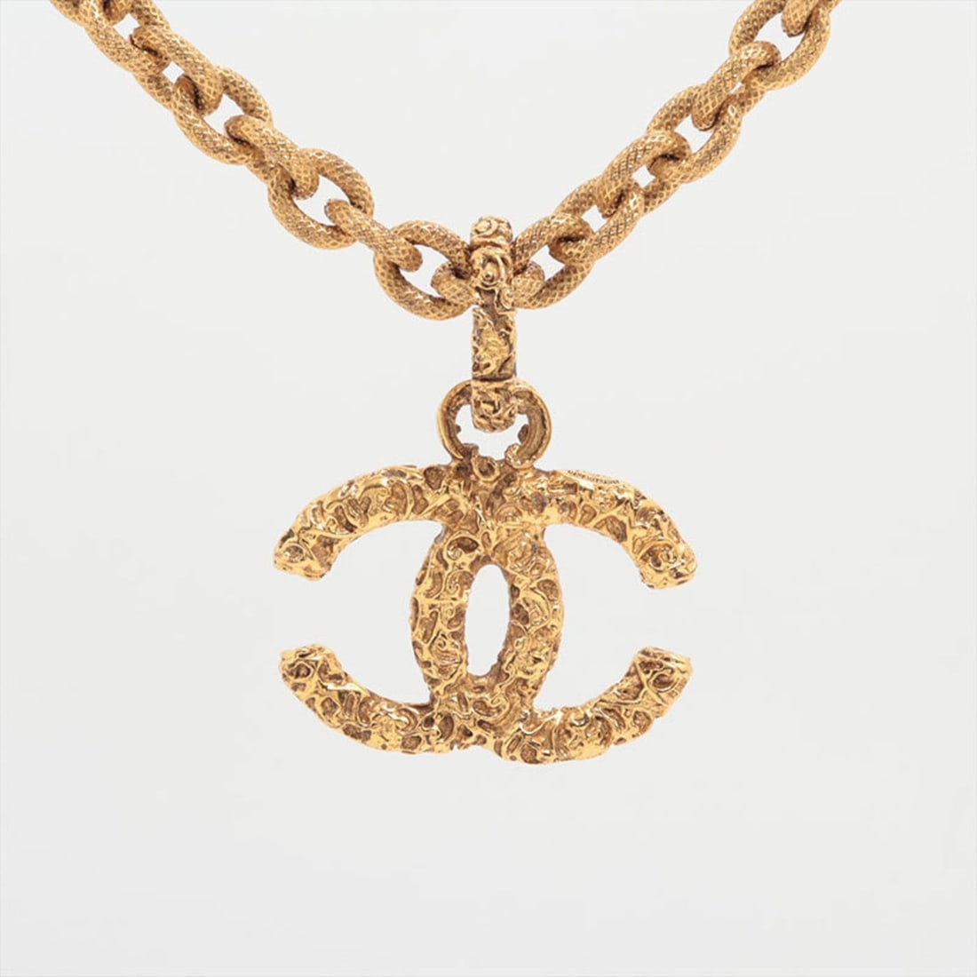 CHANEL Lava Coco Mark 1993 93A Necklace in Gold WS15923: --- Catalog ---Category: SizePendant Size: 38mm x 41mm / 1.49'' x 1.61''Neck Circumference: 46 cm / 18.11''Category: DesignColor: GoldGender: WomenNecklace Type: NecklaceCategory: GeneralBrand: Chanel