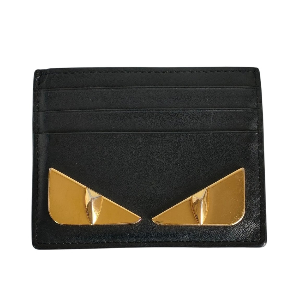 FENDI Monster Bugs Eye Leather Pass Case/Business Card Case in Black for Men and Women: --- Catalog ---Category: DesignType: Card caseColor: BlackGender: Men,WomenMaterial: Leather Category: GeneralBrand: FendiCategory: Physical PropertiesSize (HxWxD): 8cm x 10cm / 3.14'' x 3.93''--- Ite