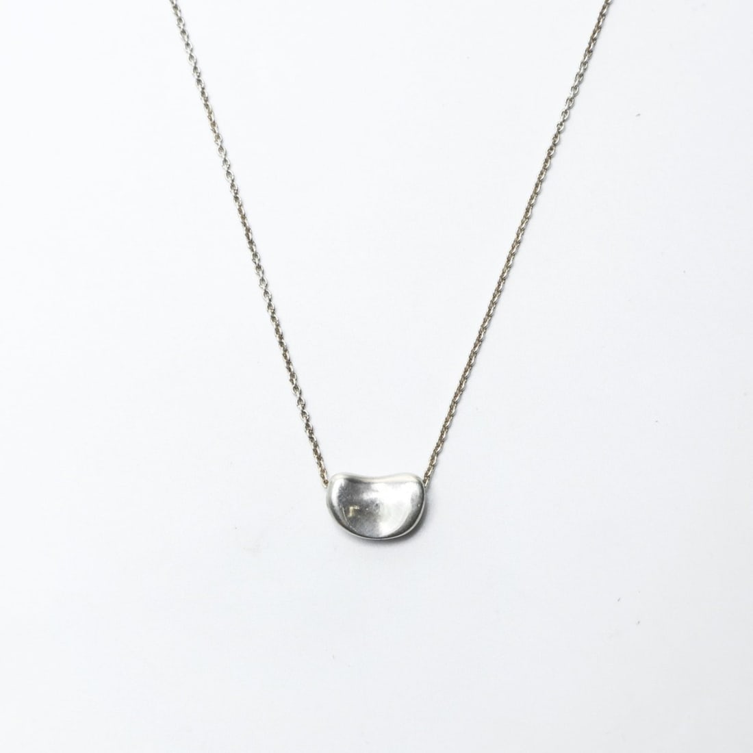 Tiffany & Co. Beans 925 Sterling Silver Necklace WS24308: --- Catalog ---Category: SizePendant Size: 6mm x 10mm / 0.23'' x 0.39''Neck Circumference: 40 cm / 15.74''Category: DesignColor: SilverGender: WomenMaterial: Silver 925Necklace Type: NecklaceCategory: