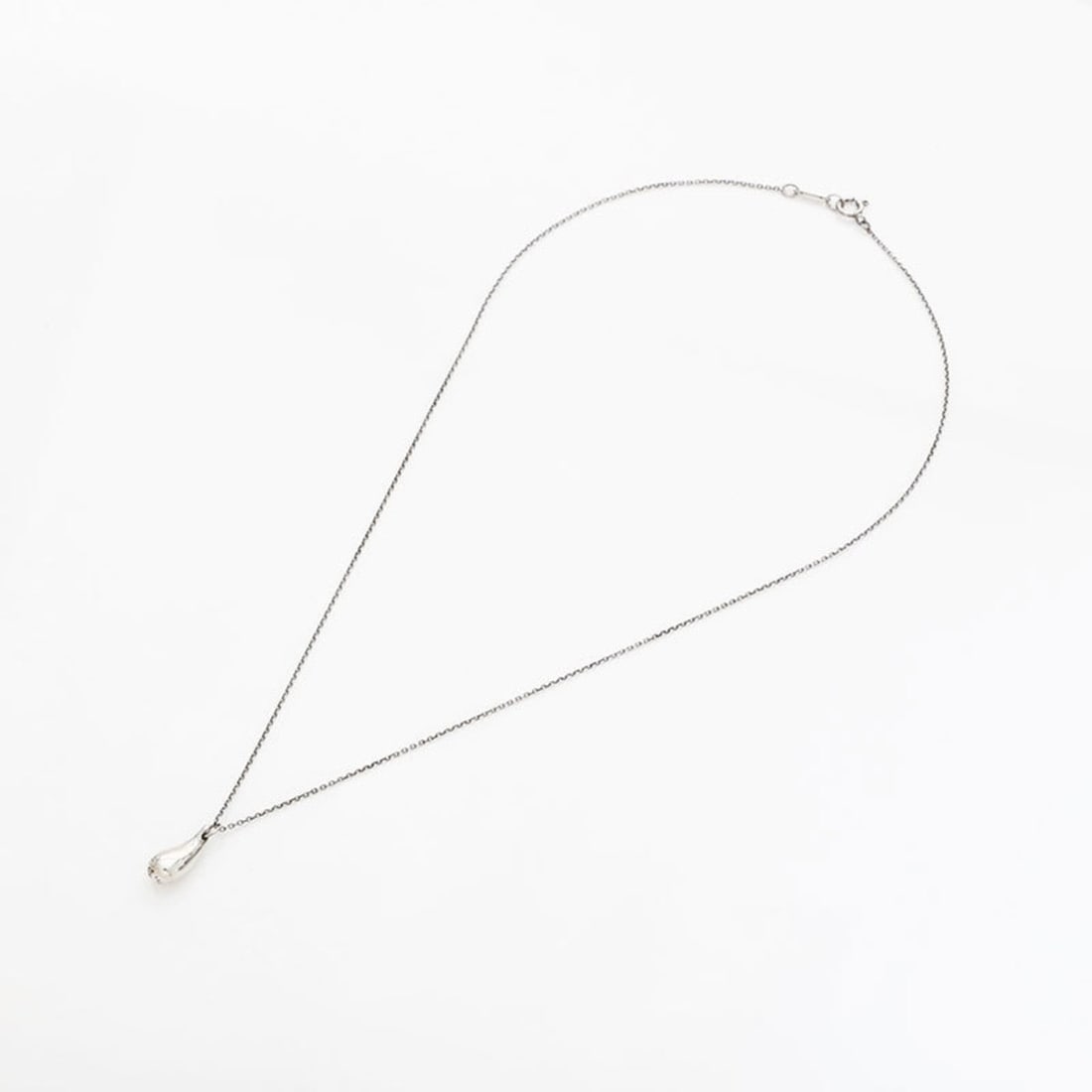 Tiffany & Co. Teardrop Necklace, Silver, WS22956: --- Catalog ---Category: SizePendant Size: 15mm x 5mm / 0.59'' x 0.19''Category: DesignColor: SilverGender: WomenNecklace Type: NecklaceCategory: GeneralBrand: Tiffany--- Item List ---Section: Conditi