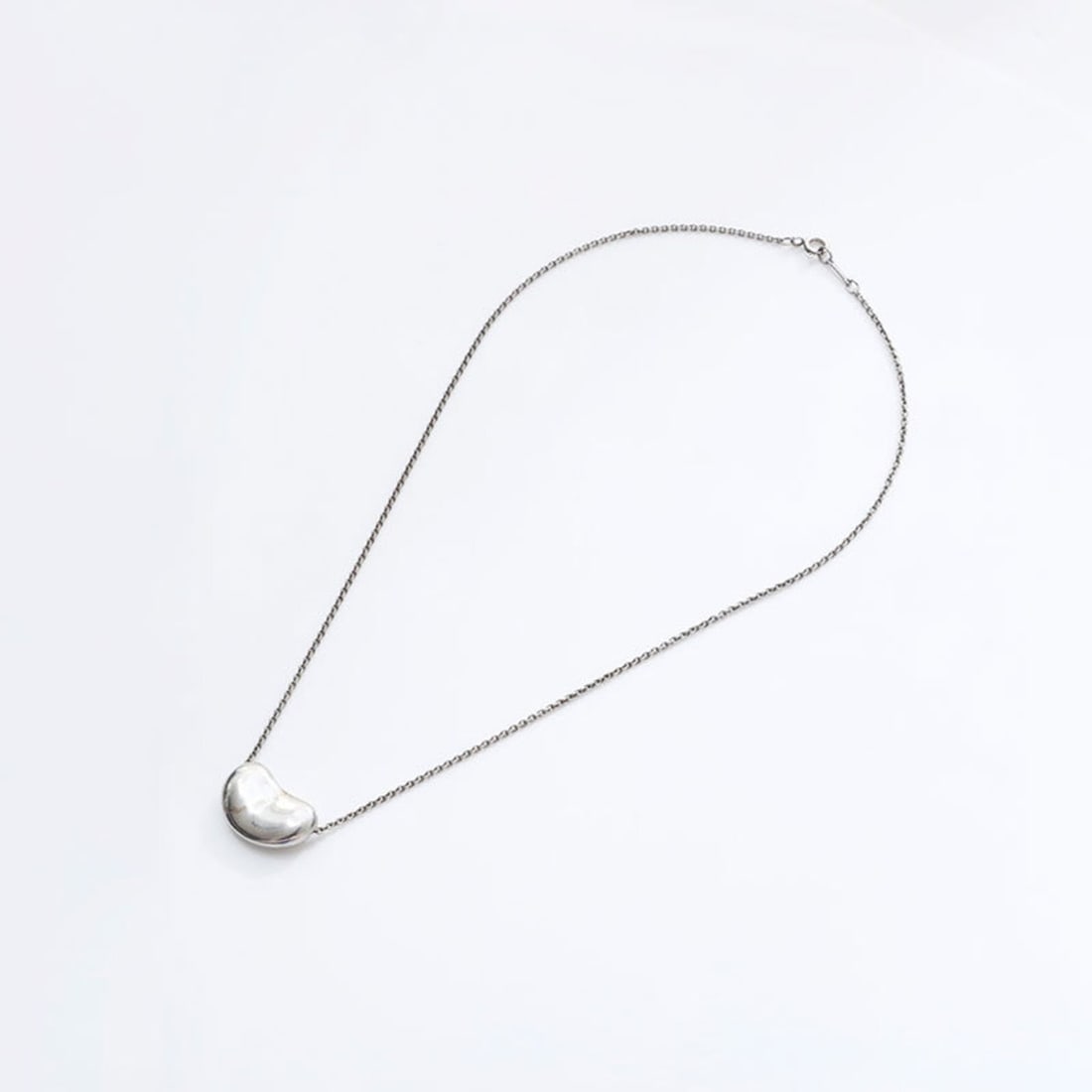 Tiffany & Co. Beans 925 Sterling Silver Necklace WS21745: --- Catalog ---Category: SizePendant Size: 15mm x 20mm / 0.59'' x 0.78''Neck Circumference: 38 cm / 14.96''Category: DesignColor: SilverGender: WomenMaterial: Silver 925Necklace Type: NecklaceCategory