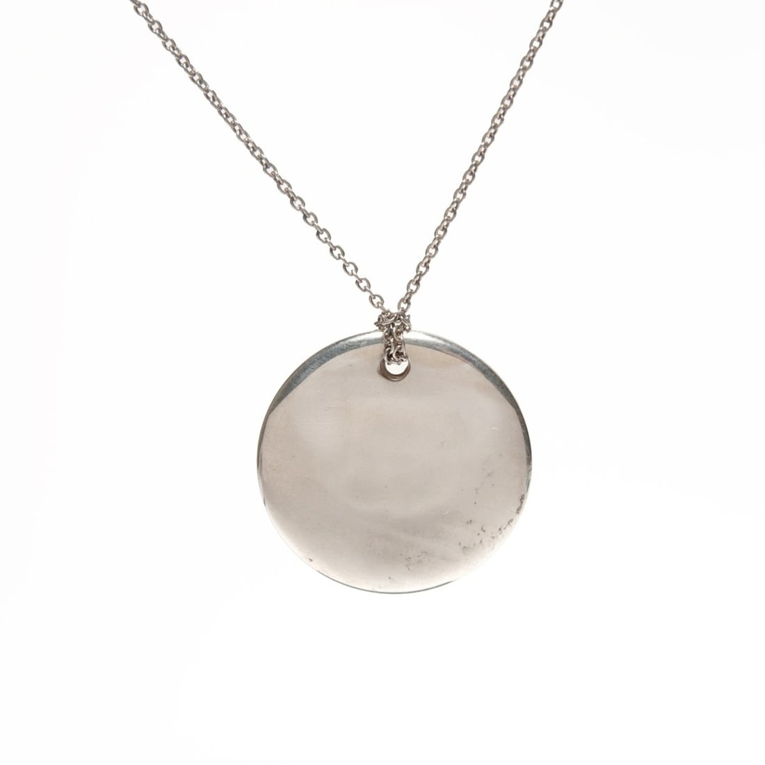 Tiffany & Co. Round Plate Necklace in 925 Sterling Silver, WS21972: --- Catalog ---Category: SizePendant Size: 23mm x 23mm / 0.9'' x 0.9''Neck Circumference: 40 cm / 15.74''Category: DesignColor: SilverGender: WomenNecklace Type: NecklaceCategory: GeneralBrand: Tiffan