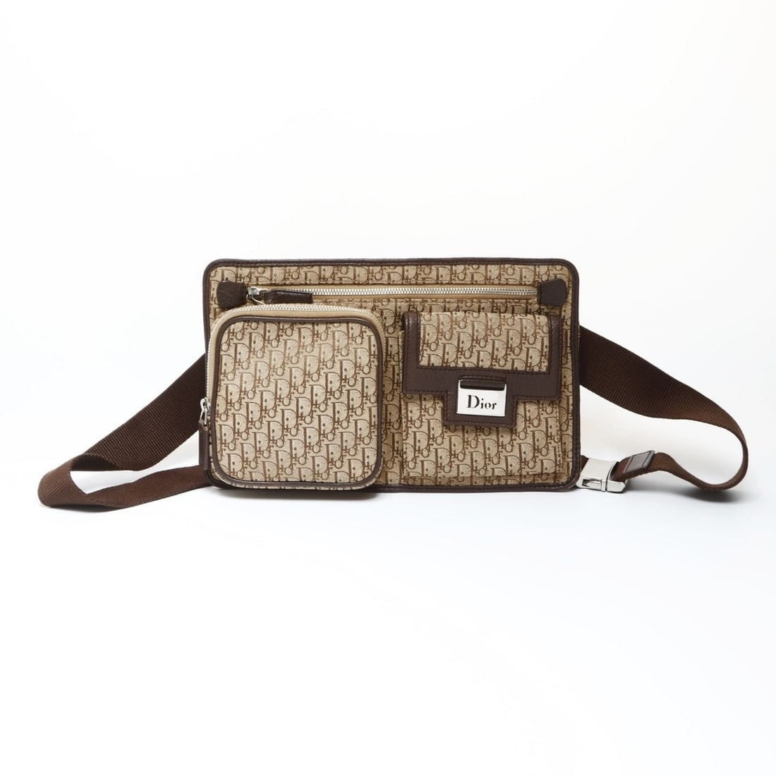 Christian Dior Trotter Canvas Waist Bag, Brown, WS26619: --- Catalog ---Category: SizeSize (HxWxD): 15.5cm x 26cm x 3cm / 6.1'' x 10.23'' x 1.18''Strap Length: 53cm - 100cm / 20.86'' - 39.36''Category: DesignType: Fanny packColor: BrownGender: WomenMaterial