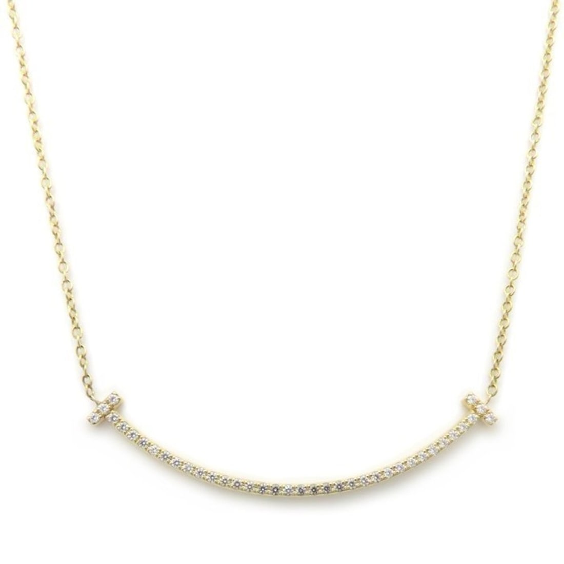 TIFFANY & Co. Tiffany T Smile Necklace, Small Diamond, 18K White Gold, Women's, 63058777, 295166: --- Catalog ---Category: SizePendant Size: 3.6mm x 37.1mm / 0.14'' x 1.46''Neck Circumference: 42 cm / 16.53''Category: DesignColor: Yellow goldStone: DiamondGender: WomenMaterial: Yellow gold (18K)Ne