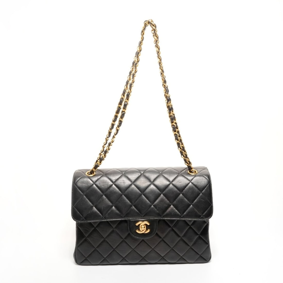 CHANEL No. 4 1996-1997 Double-Face Matelasse Lambskin Shoulder Bag in Black: --- Catalog ---Category: SizeStrap Drop: 66cm / 25.98''Size (HxWxD): 20cm x 29cm x 10cm / 7.87'' x 11.41'' x 3.93''Category: DesignType: Shoulder bagColor: BlackGender: WomenMaterial: Leather Leather/
