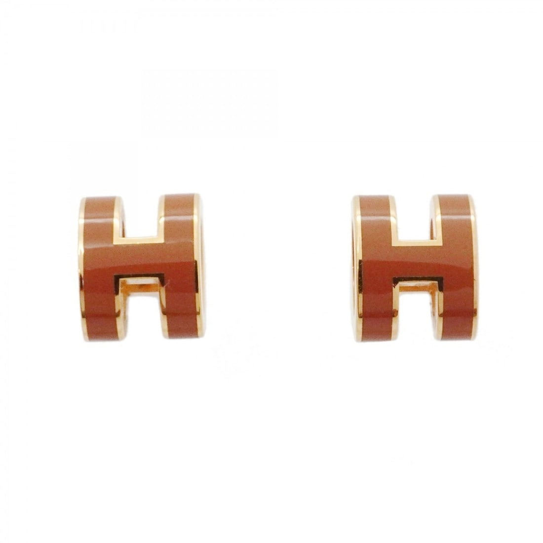 Hermes Mini Pop Ash Earrings, GP Plated, Gold, Brown, Women's: --- Catalog ---Category: SizeSize (HxWxD): 9.00mm x 7.30mm / 0.35'' x 0.29''Category: DesignType: Stud earringsColor: Brown, GoldGender: WomenMaterial: Gold platingCategory: GeneralBrand: Hermes--- It