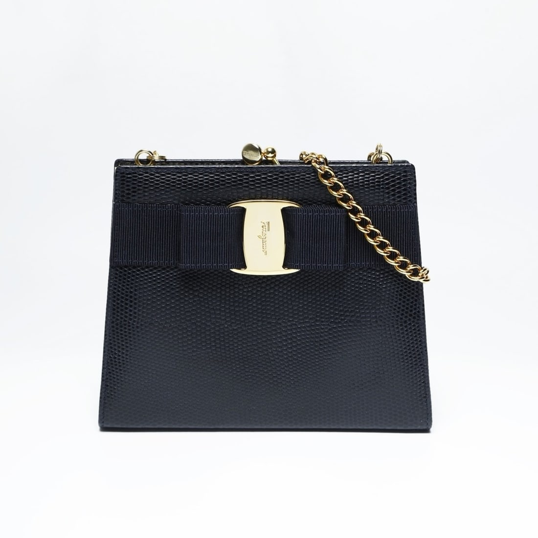 Salvatore Ferragamo Vara Mini Chain Shoulder Bag in Navy: --- Catalog ---Category: SizeSize (HxWxD): 12.5cm x 16cm x 4.5cm / 4.92'' x 6.29'' x 1.77''Strap Length: 114cm / 44.88''Category: DesignType: Shoulder bagColor: NavyGender: WomenCategory: GeneralLine: