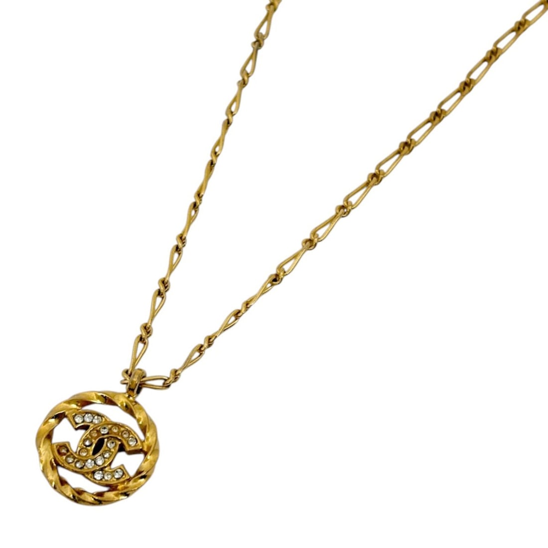 CHANEL Coco Mark Rhinestone Round Necklace in GP Gold for Women: --- Catalog ---Category: SizePendant Size: 1.7mm x 2.1mm / 0.06'' x 0.08''Neck Circumference: 38 cm / 14.96''Category: DesignColor: GoldGender: WomenMaterial: Gold platingNecklace Type: NecklaceCatego