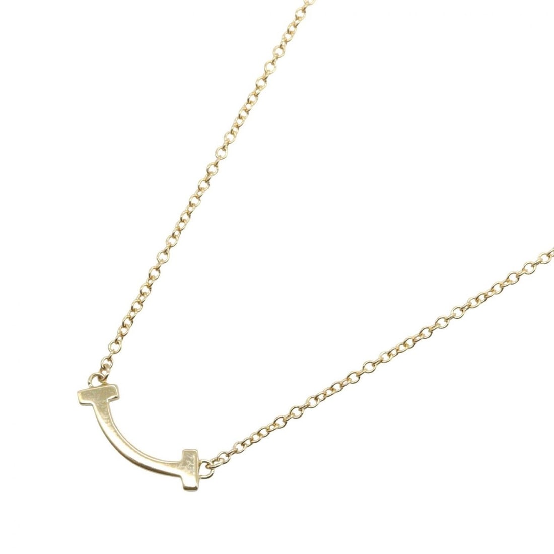 Tiffany & Co. T Smile Mini Necklace, 18K (Yellow Gold), Women's Jewelry, Gold Tone: --- Catalog ---Category: SizePendant Size: 3mm x 13mm / 0.11'' x 0.51''Neck Circumference: 40.5 cm - 45 cm / 15.94'' - 17.71''Category: DesignColor: GoldGender: WomenMaterial: Yellow gold (18K)Necklac
