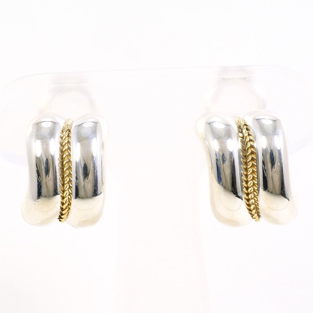 Tiffany & Co. Twist Earrings in 18K White Gold and 925 Sterling Silver. Total weight: approximately: --- Catalog ---Category: DesignType: Stud earringsGender: WomenMaterial: Silver 925, Yellow gold (18K)Category: GeneralBrand: Tiffany--- Item List ---Section: ConditionRanking: Rank SA Used - Hardly a