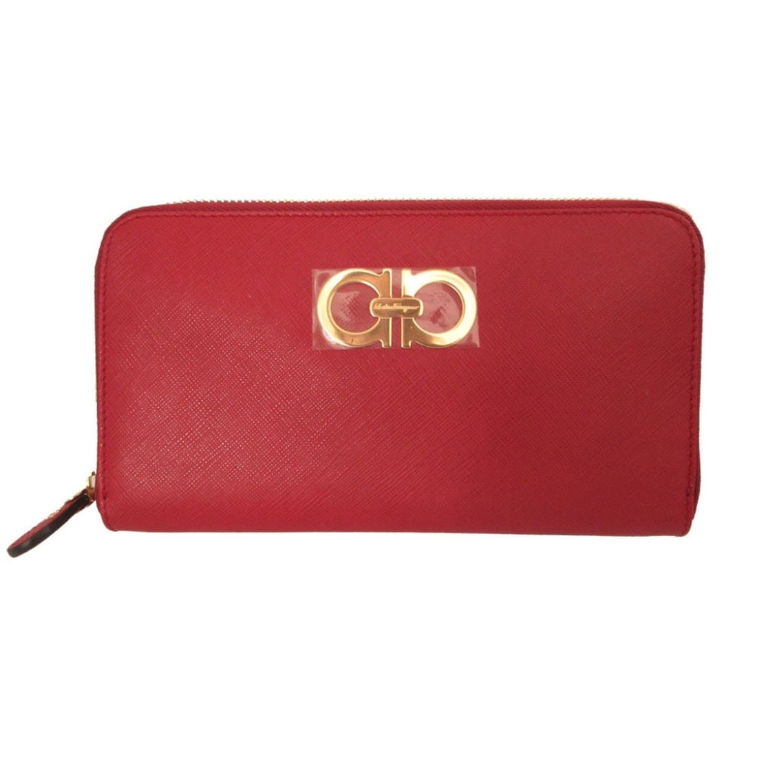 Like new Salvatore Ferragamo Gancini leather red zip-around long wallet 0450Salvatore: --- Catalog ---Category: SizeSize (HxWxD): 11cm x 19.5cm x 2cm / 4.33'' x 7.67'' x 0.78''Category: DesignType: Long wallet (bi-fold)Color: Red colorGender: WomenMaterial: Leather Category: GeneralBran