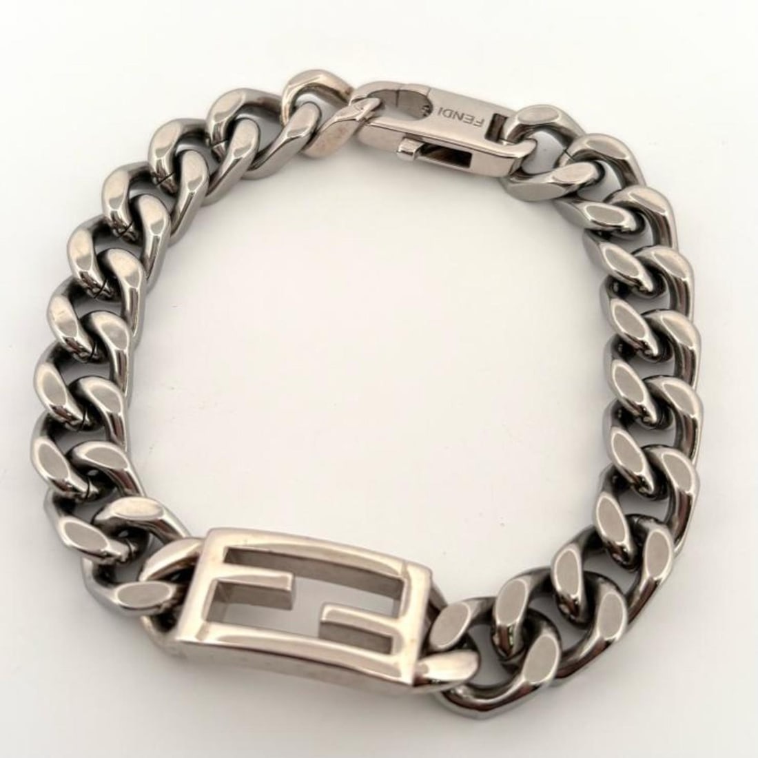 FENDI FF Baguette Bracelet with Silver Chain, Made in Italy: --- Catalog ---Category: SizeLength: 19cm / 7.48''Category: DesignType: Charm braceletColor: SilverGender: Women,MenMaterial: Stainless steelCategory: GeneralBrand: Fendi--- Item List ---Section: