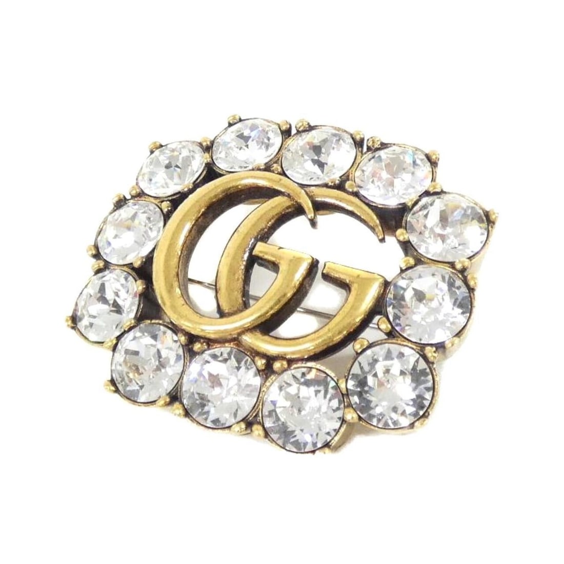 Gucci 504857 J1D50 Brooch: --- Catalog ---Category: SizeSize (HxWxD): 3.8cm x 4.5cm / 1.49'' x 1.77''Category: DesignType: BroochColor: Clear, GoldGender: WomenCategory: GeneralMPN: 504857 J1D50Brand: Gucci--- Item List