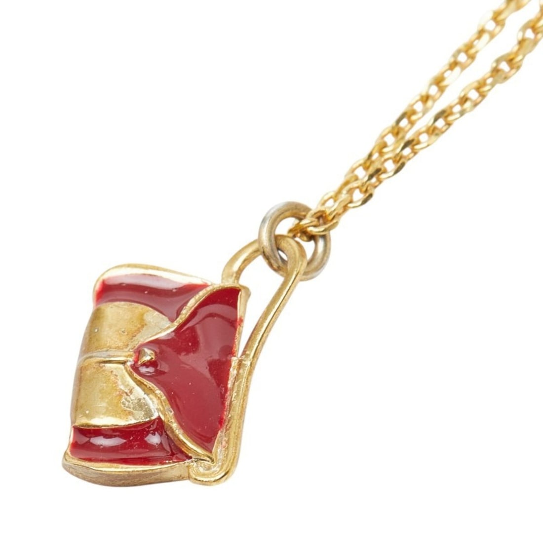 Celine handbag motif chain pendant necklace, gold and red plated enamel, for women. CELINE: --- Catalog ---Category: SizePendant Size: 17.2mm x 13.1mm / 0.67'' x 0.51''Neck Circumference: 54 cm / 21.25''Category: DesignColor: Gold, Red colorGender: WomenMaterial: EnamelNecklace Type: Necklac